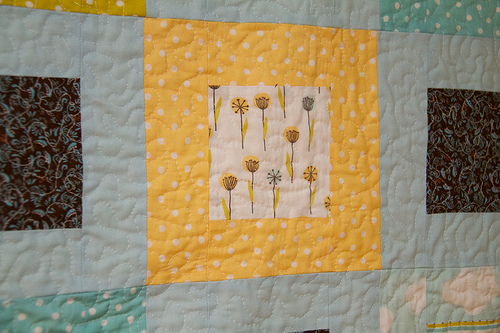My Happy Garden in 'Meadow' and a speckled pattern called 'Sun' Baby Boy Quilt