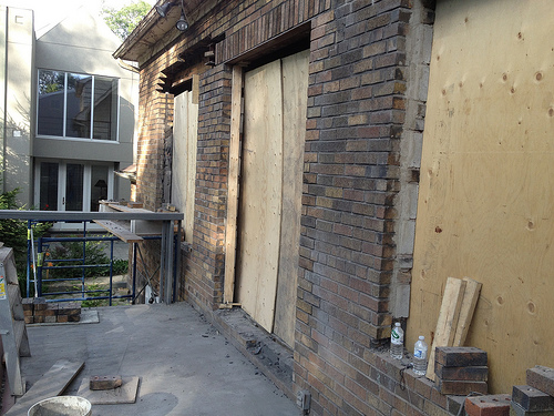 Windows and doors being bricked in at back of house